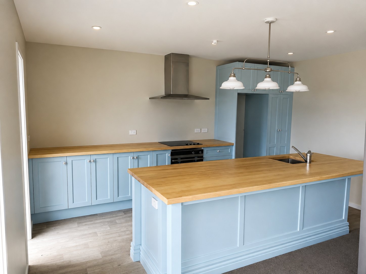 Kitchen cabinetry hand painted in a soft duck egg blue