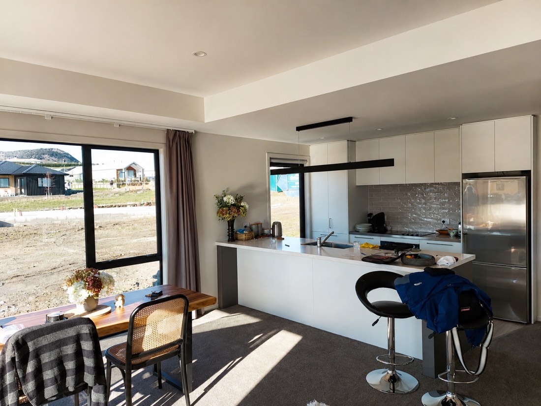 Bright white kitchen and dining space after an interior repaint